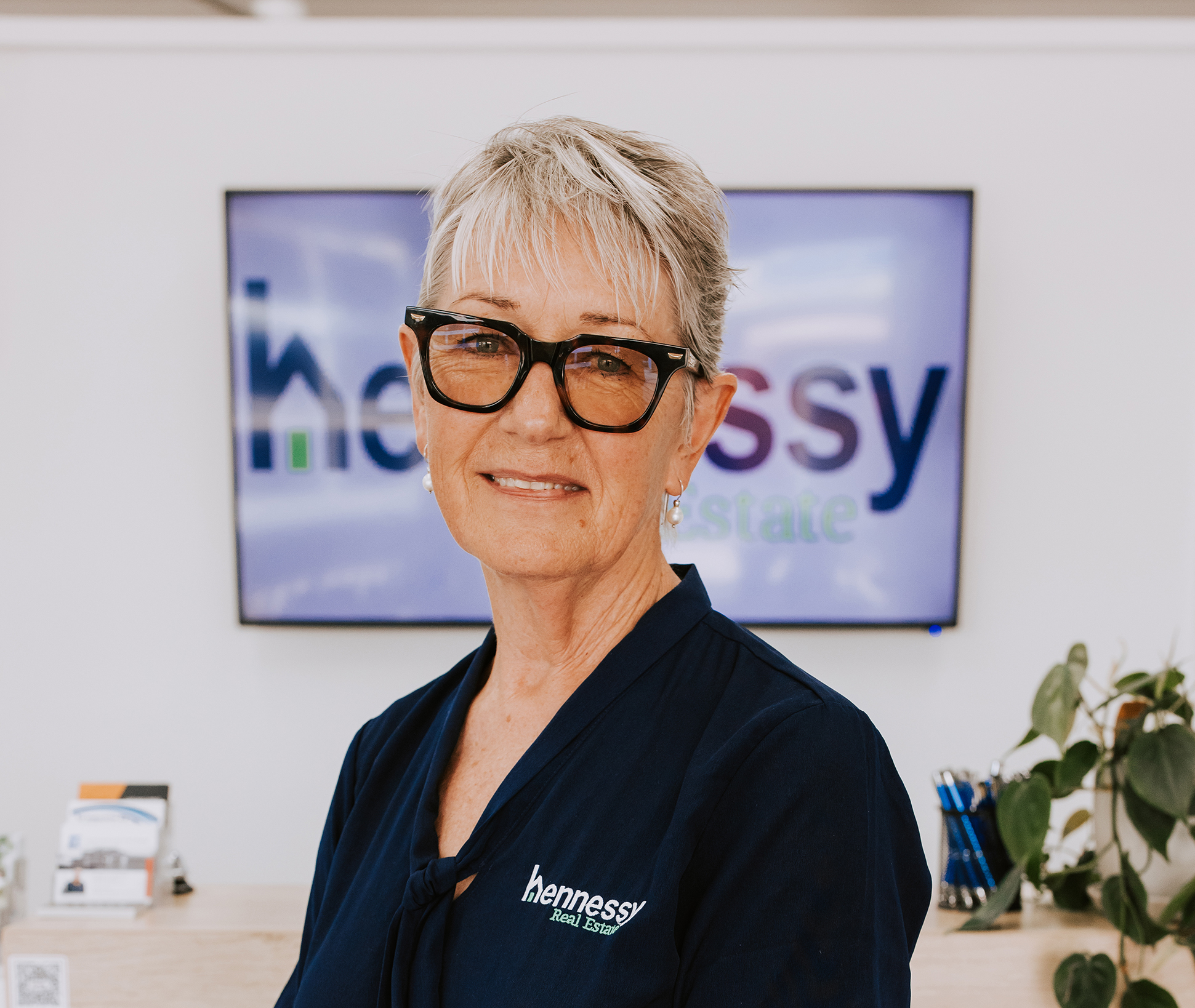 Friendly, familiar face ready to welcome you at Hennessy Real Estate