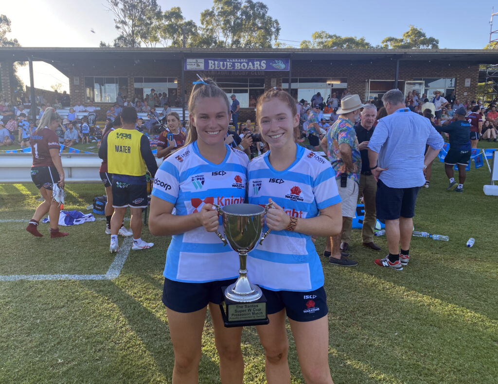 Former Narrabri Blue Boars duo Brooke McKinnon and Martha Harvey with the Santos Super W Cup after the NSW Waratahs won the inaugural clash against the Queensland Reds. Both girls debuted for NSW in that match, which was played at Dangar Park during the Santos Festival of Rugby.