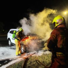 Firefighters extinguish vehicle blaze