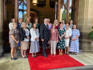 Government House reception, back, Lisa Horner, Jessica Towns, Jo Balcombe, Maree Pobje, Samantha Coppin, Rubey Williams, Sarah Wood, Florence McGufficke, front, Olivia McDonnell, Tara Coles, Kendall Goldspink, Mr Dennis Wilson, Governor of NSW Margaret Beazley, Hannah Messner, Shannon Moran and Peyton Ford.