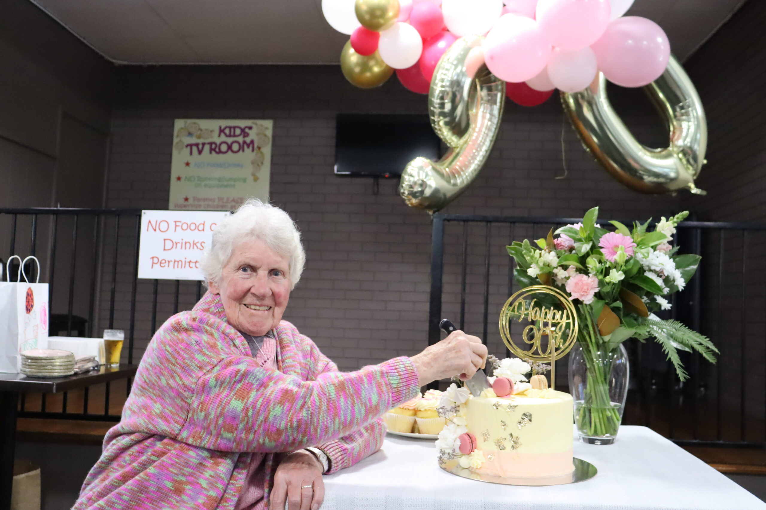 Ellen Eather’s family helps her celebrate her 90th