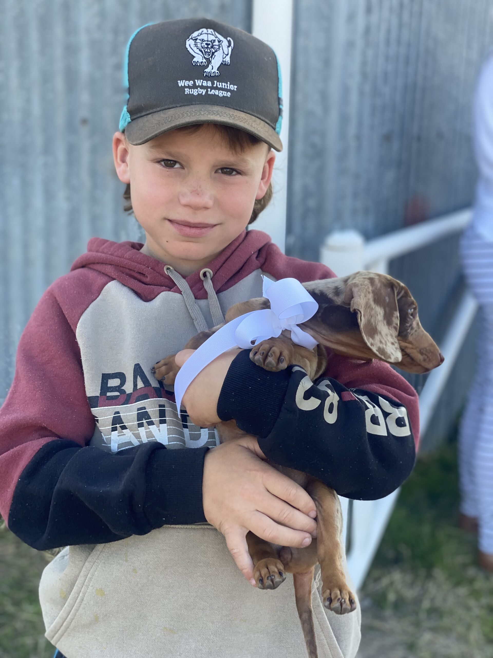 Leyton Carroll with his puppy Luna.