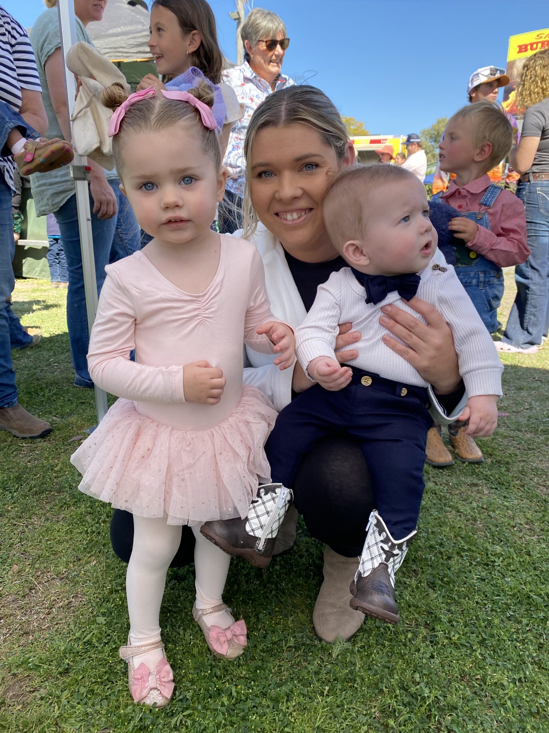 above, baby show: Jennifer Nield with baby show winners Emelia and Hudson Pennell.
