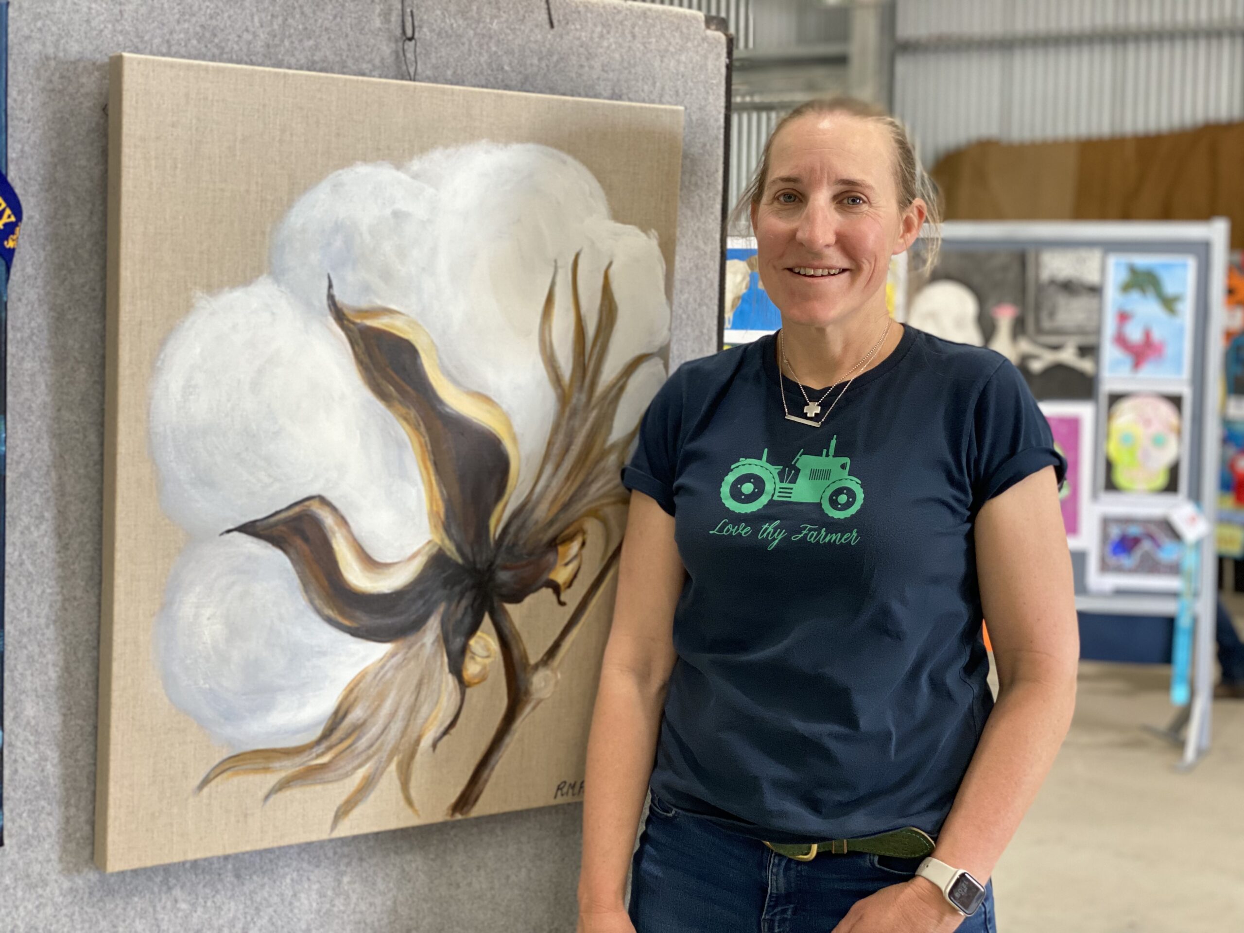Melinda Palmer standing next to her mum Rhonda’s magnificent painting.