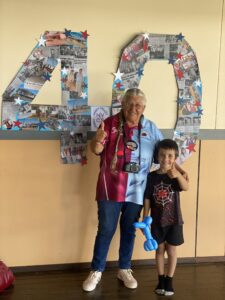 Vida Dewson with her great-grandson Mark Anderson. Mrs Dewson said she’s had grandchildren and great grandchildren attend NVCS. Some newspaper clippings she’s kept over the years were used to make the number 40, to mark the anniversary.