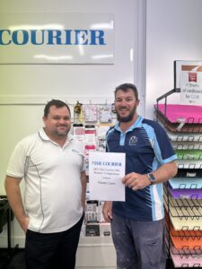 The Courier’s general manager Dylan Smith with Readers’ competition winner Danny Laws.