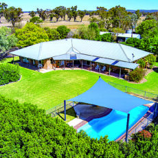 Quality brick homestead on prime acreage