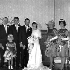 Bride wore white satin and lace