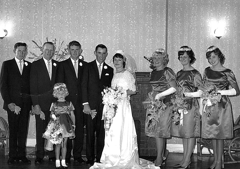 Bride wore white satin and lace