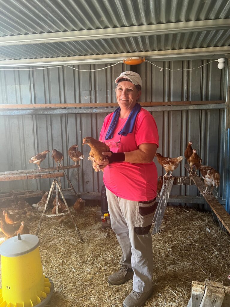 Kerry Holmes with the chooks.