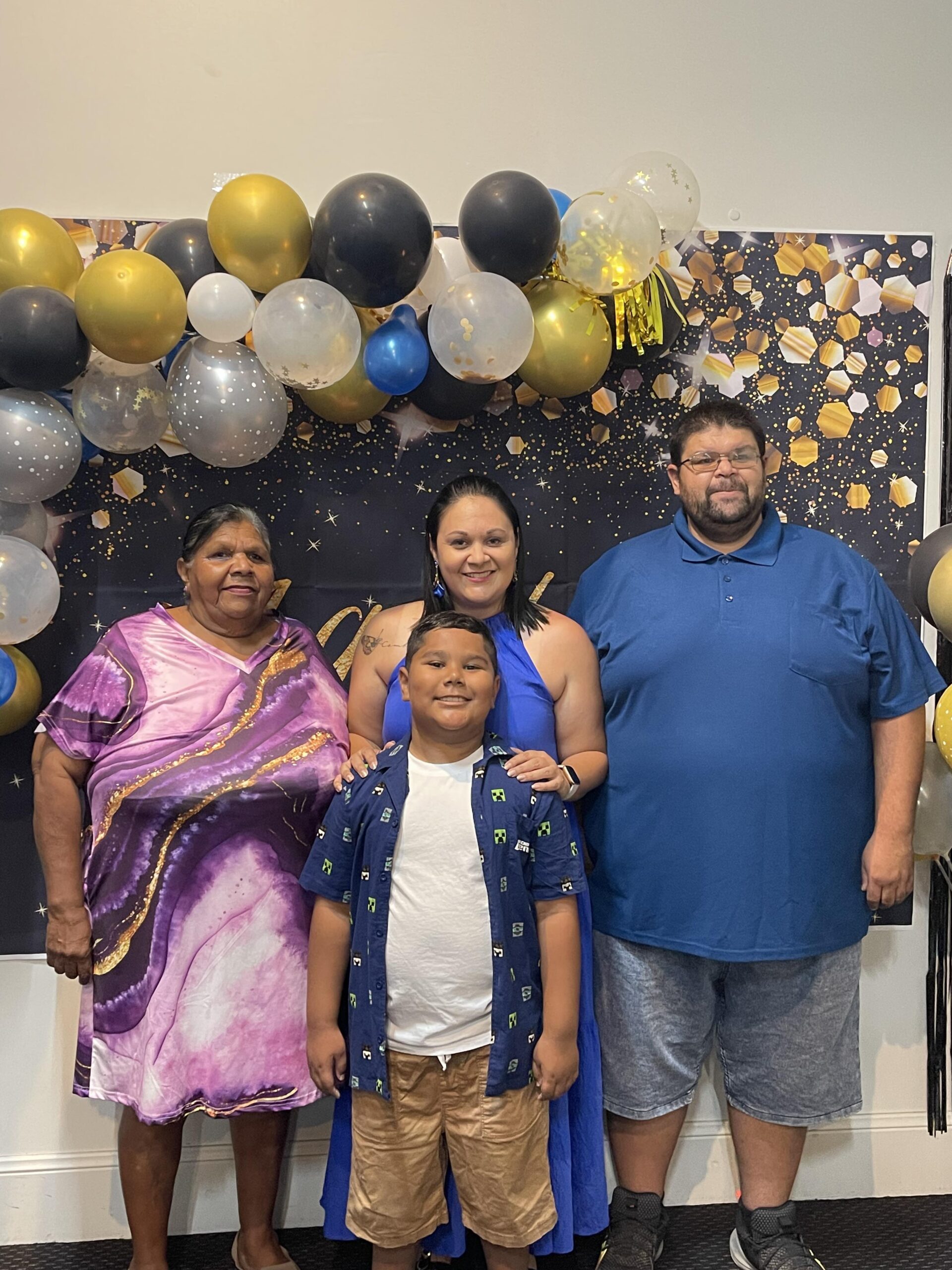 Michelle Combo, centre, with her mum Colleen, brother Luke and son Siaosi Manu (George) at Michelle’s birthday celebrations in Wee Waa.