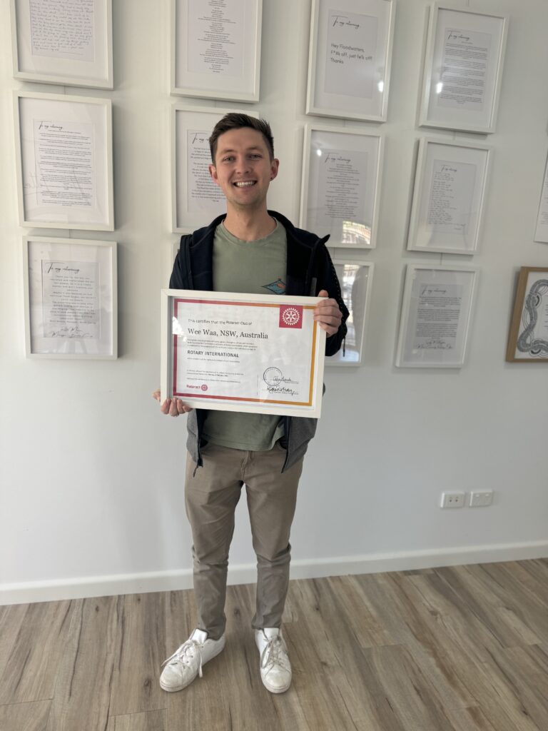 Wee Waa Rotaract president and active community member Ethan Towns recently attended a meeting about the RiverBank Youth Works. Ethan is pictured holding the Rotaract charter at the Wee Waa Community Arts and Cultural Centre, where the group is now based.