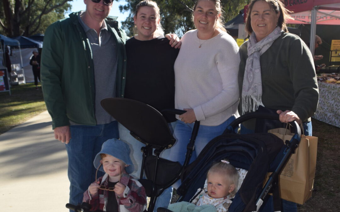 Sun shines as markets mark official debut at new location