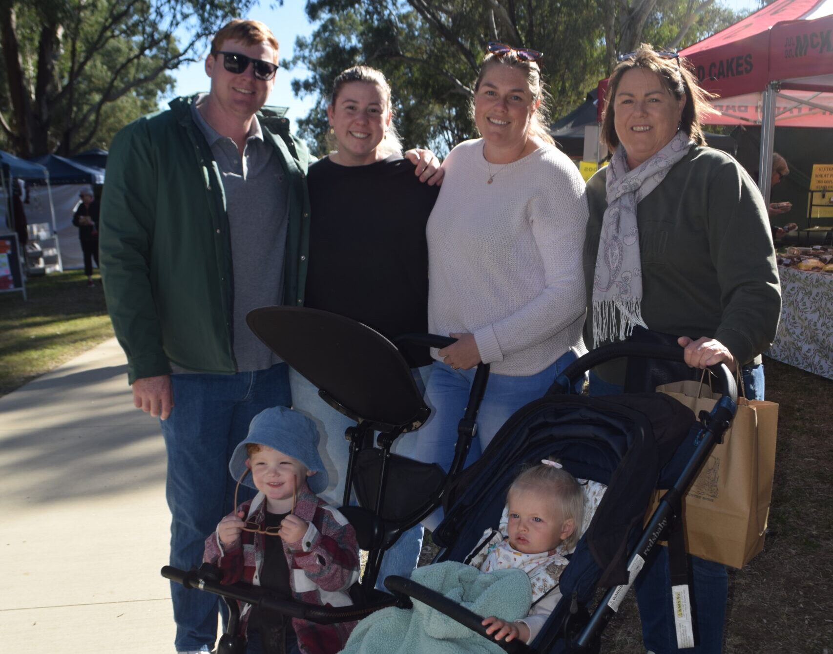 Sun shines as markets mark official debut at new location