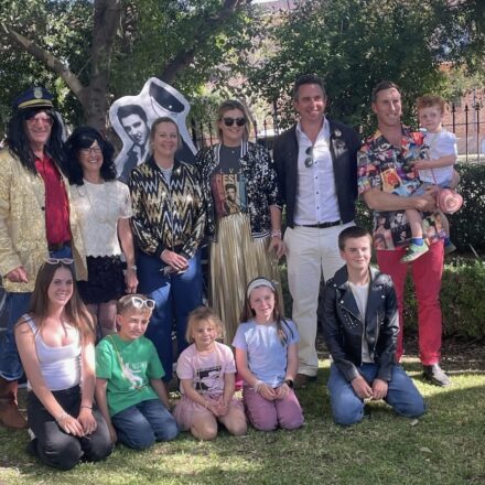Phelps Family: Jono and Wendy Phelps, Libby Brennan, Anna Hall, James Brennan, James and Lenny Hall, front, Lilly Brennan, Percy and Emmeline Hall, Phoebe and Eddie Brennan. Guests were all shook up as they slipped on their blue suede shoes and donned their best Elvis‑era outfits to celebrate Jono Phelps’ 70th birthday at House on Rose recently. The birthday bash was also an impressive fundraiser, with $12,000 rallied for the vital WRHS.