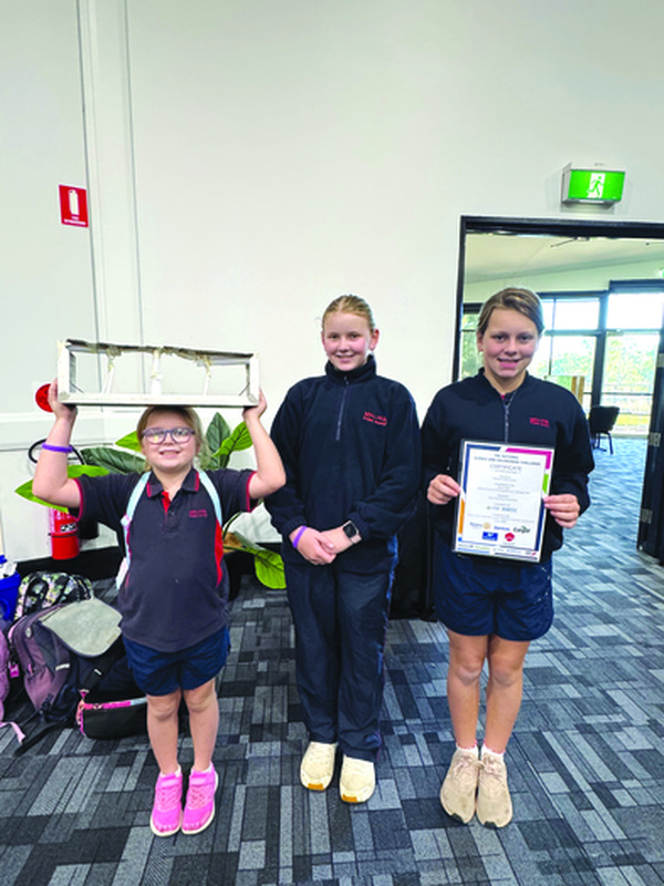 Wee Waa Public School students Indi Johnson, Caitlin Rabbett, Ruby-Lee Smith and Tynarla Baker with volunteer Kirk Harvey.